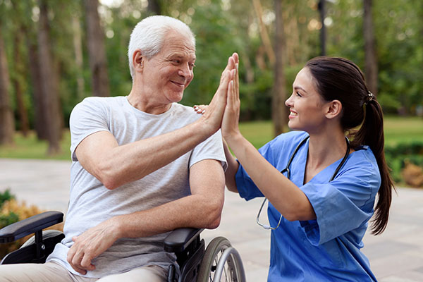 nurse helping patient in wheelchair - physical injury